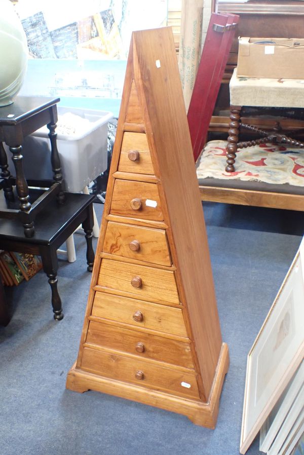 A PYRAMIDAL CHEST OF DRAWERS