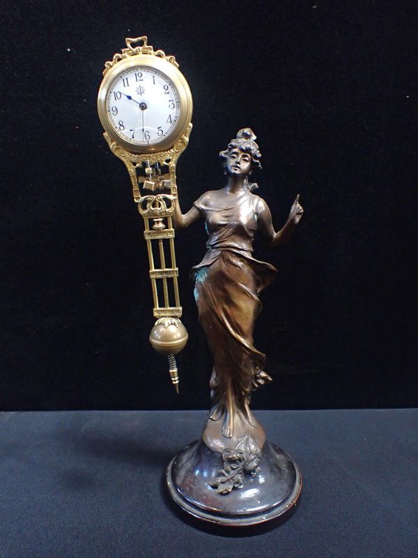 A BELLE EPOQUE STYLE 'MYSTERY' FIGURAL CLOCK