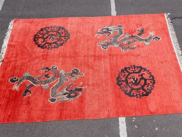 A LARGE RED CHINESE RUG