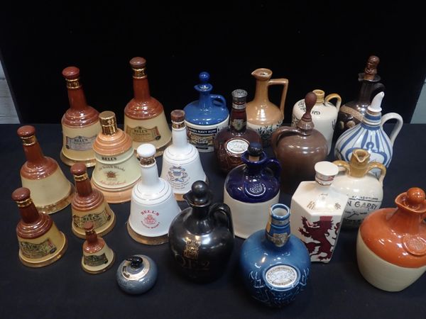 A COLLECTION OF STONEWARE WHISKY JUGS