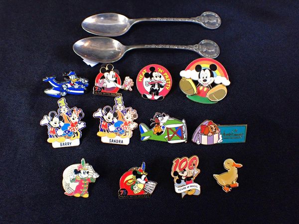A COLLECTION OF DISNEY BADGES