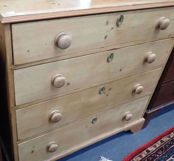 A 19TH CENTURY STRIPPED PINE CHEST OF FOUR DRAWERS