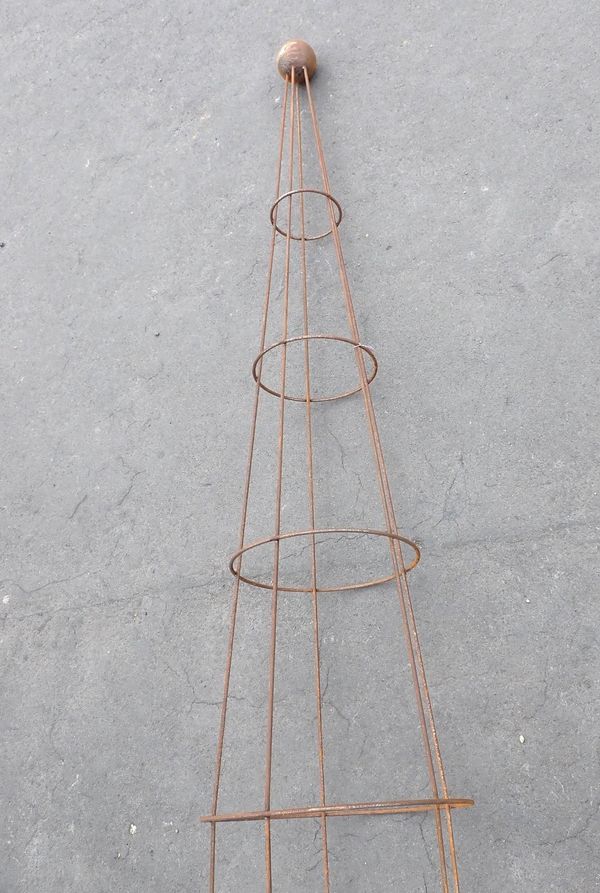 A METAL GARDEN OBELISK