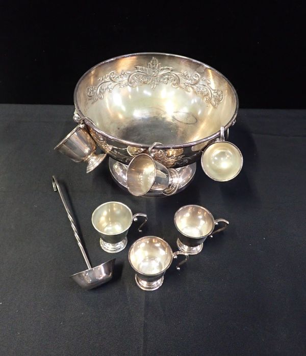 A SILVER PLATED PUNCH BOWL, LADLE AND CUPS