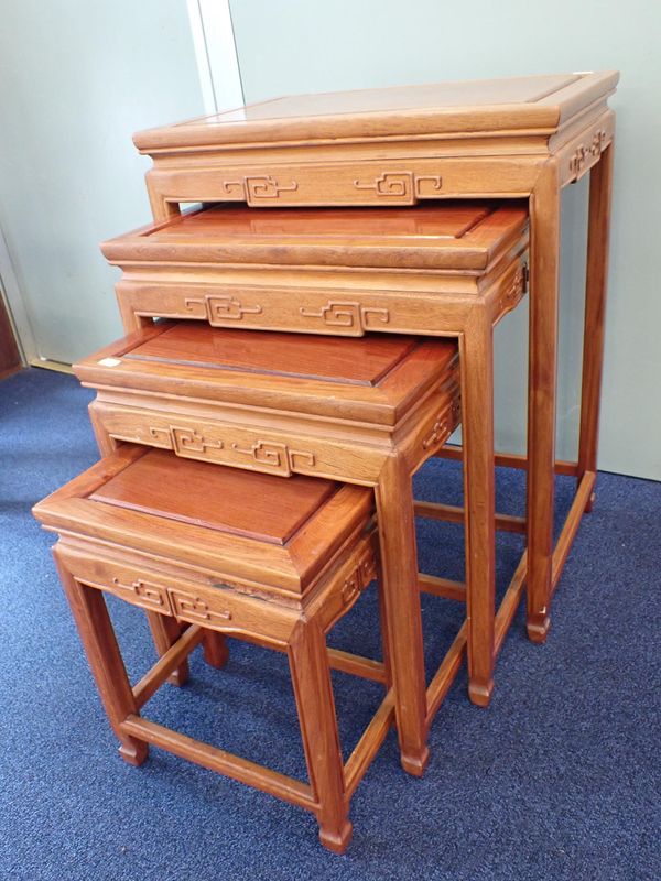 A NEST OF FOUR CHINESE HARDWOOD TABLES