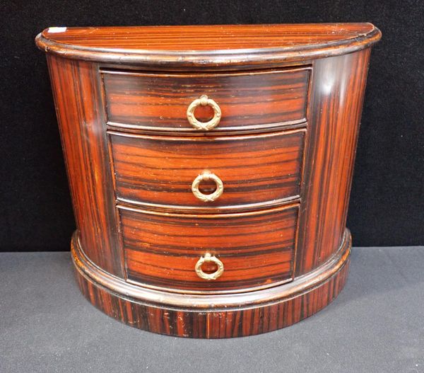 A FAUX ROSEWOOD MINIATURE DEMI-LUNE CHEST OF DRAWERS