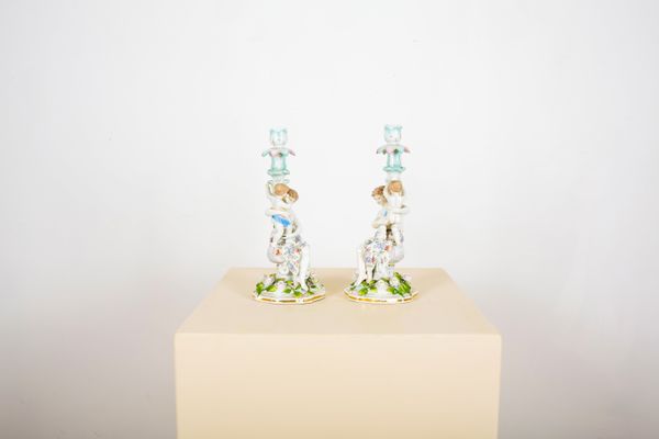 A PAIR OF DRESDEN PORCELAIN CANDLESTICKS