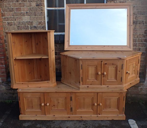 A LOW PINE FOUR DOOR CUPBOARD, A PINE GATELEG TABLE