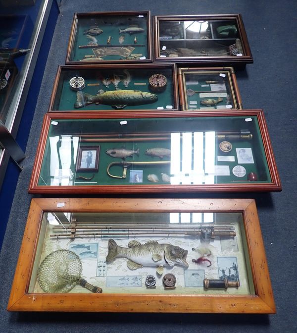 A COLLECTION OF FISHING THEMED DECORATIVE DISPLAYS