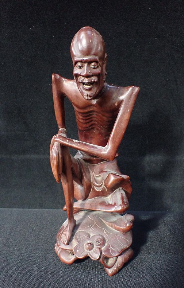 A JAPANESE CARVED HARDWOOD FIGURE