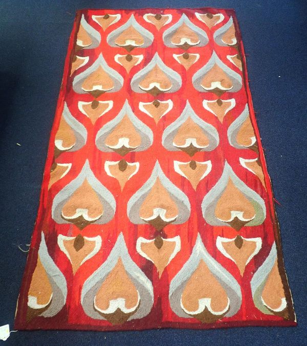 A WOOL WORK RUG, WORKED WITH STYLISED HEART MOTIFS