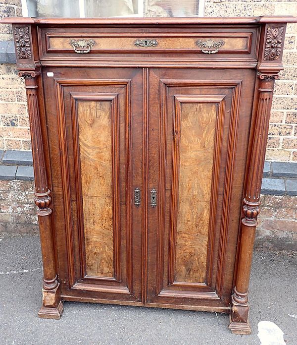 A VICTORIAN FIGURED WALNUT CABINET