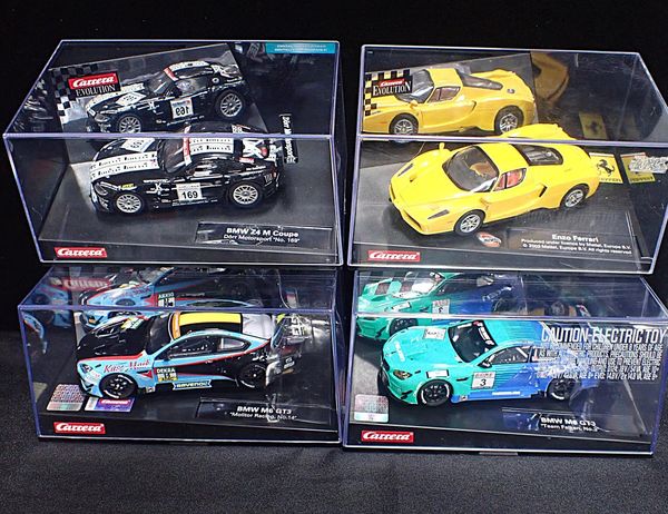 FOUR CARRERA EVOLUTION SLOT CARS