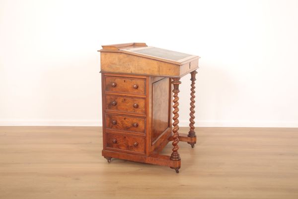 A VICTORIAN WALNUT AND MAHOGANY DAVENPORT