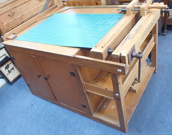 A BOOKBINDING WORKBENCH, FITTED DOUBLE DOORS