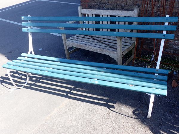 A SLATTED WOOD AND IRON GARDEN BENCH