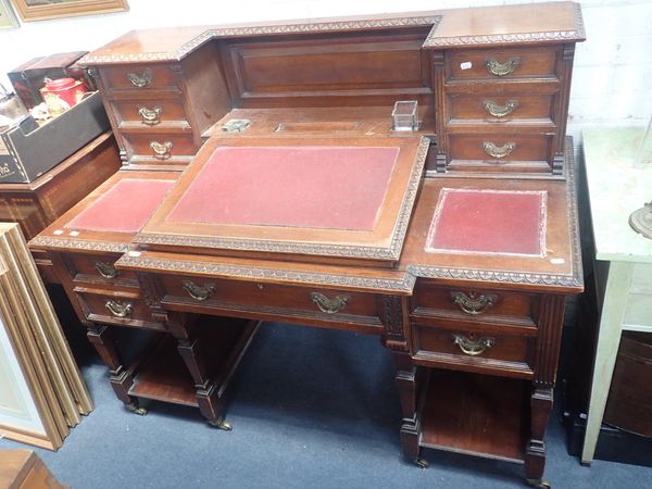 A LATE VICTORIAN WALNUT 'DICKENS' TYPE DESK