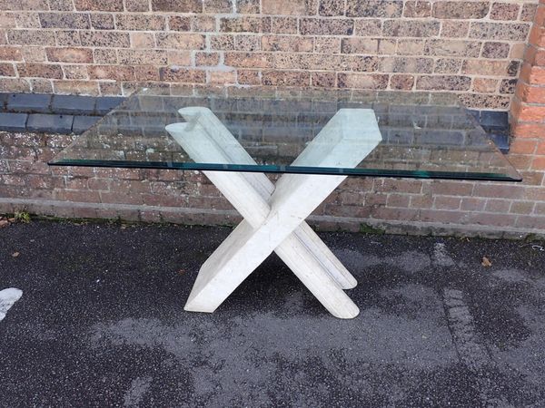 A CONTEMPORARY GLASS-TOPPED TABLE