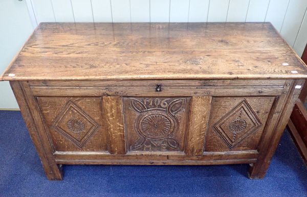 A PANELLED OAK CHEST, CARVED WITH THE DATE '1706'