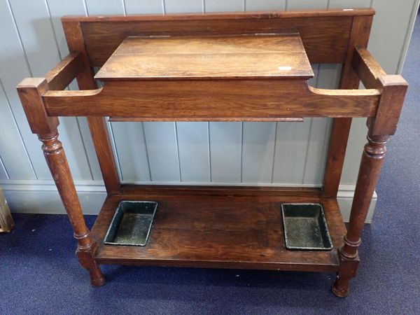 AN EDWARDIAN OAK HALL STAND