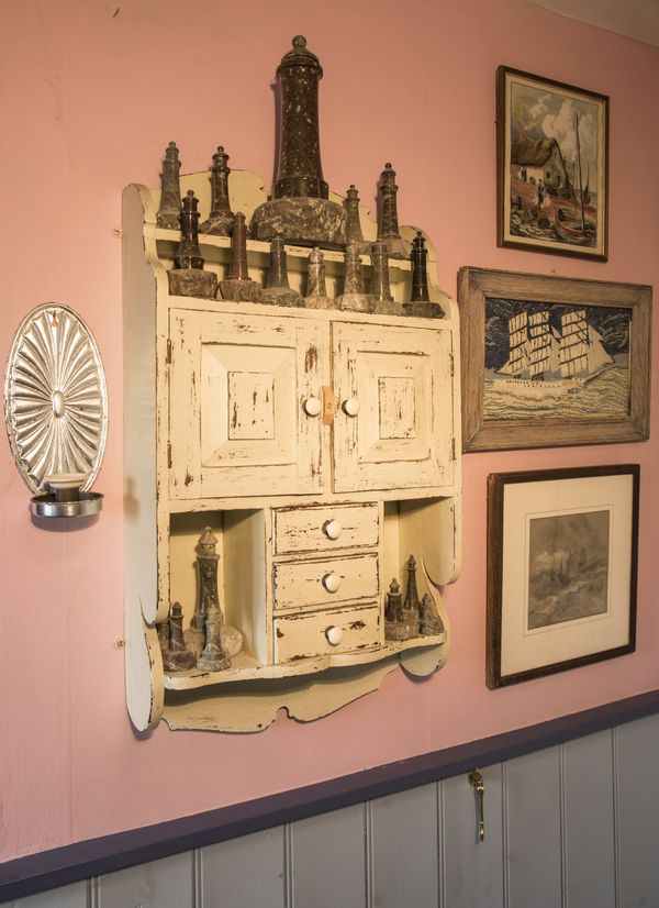 AN EDWARDIAN CREAM-PAINTED WALL CUPBOARD