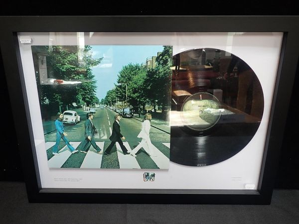 A FRAMED LIMITED EDITION THE BEATLES 'ABBEY ROAD' VINYL RECORD