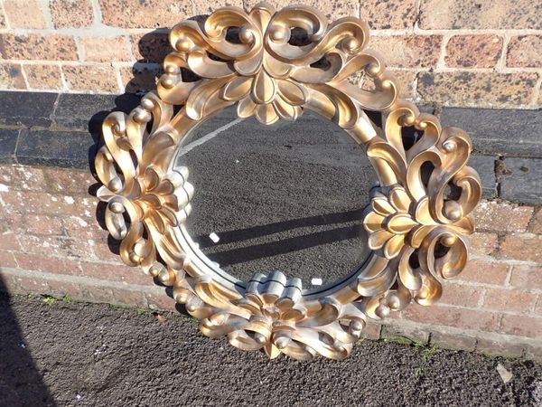 A MODERN MOULDED AND GILT WALL MIRROR