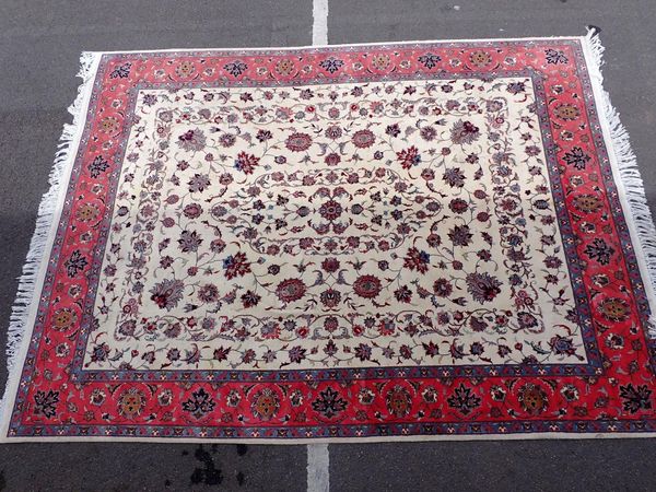 A LARGE PERSIAN STYLE RUG