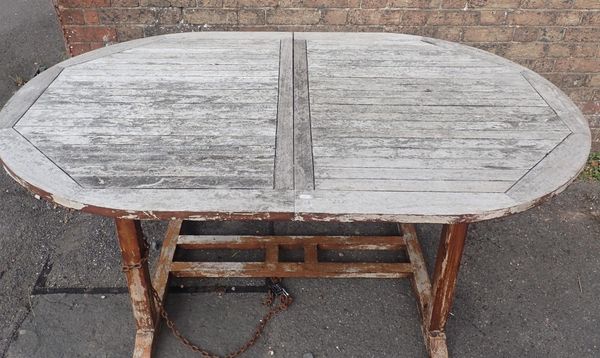 A TEAK OVAL GARDEN TABLE