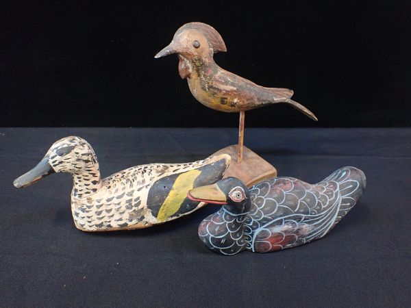 A DECOY DUCK, WITH OLD WORN PAINT SURFACE