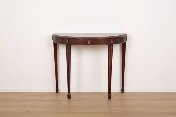 A GEORGE III STYLE MAHOGANY AND PARCEL GILT SIDE TABLE