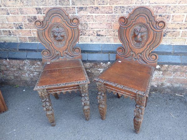 A PAIR OF VICTORIAN OAK HALL CHAIRS