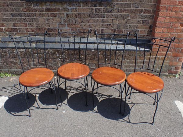 A SET OF FOUR SCROLLED METAL GARDEN/CONSERVATORY CHAIRS