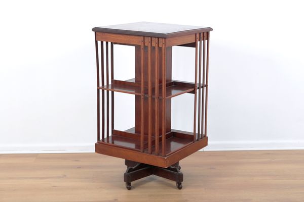 A MAHOGANY REVOLVING OPEN BOOK CASE
