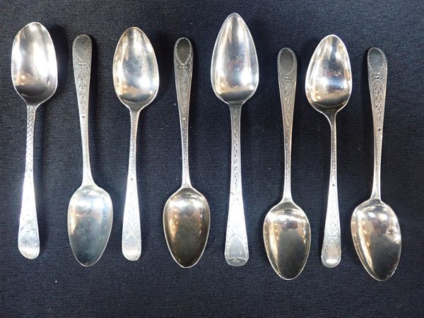 A NEAR SET OF SILVER TEA SPOONS