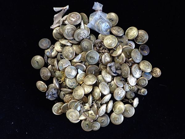 A QUANTITY OF BRASS BUTTONS