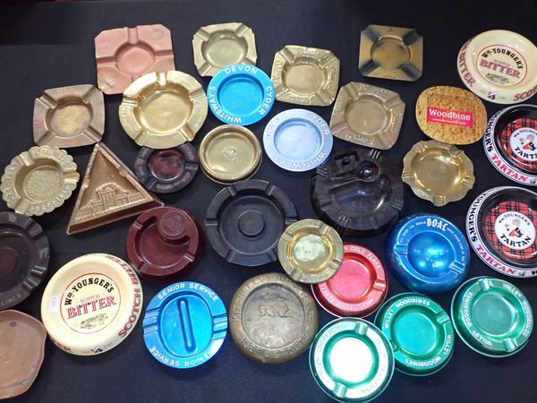 A COLLECTION OF METAL AND BAKELITE ADVERTISING ASHTRAYS