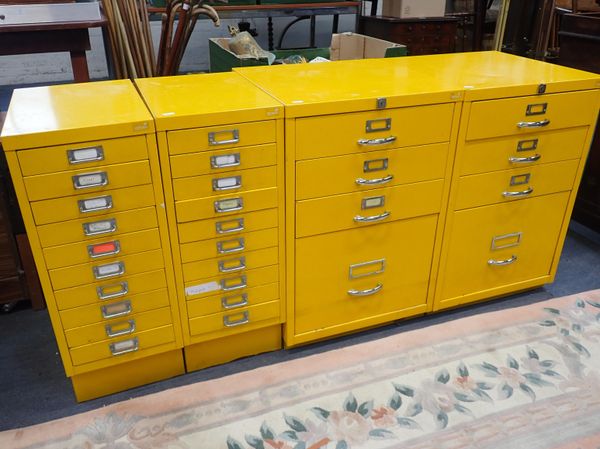 A PAIR OF BRIGHT YELLOW RYMAN FILING CABINETS