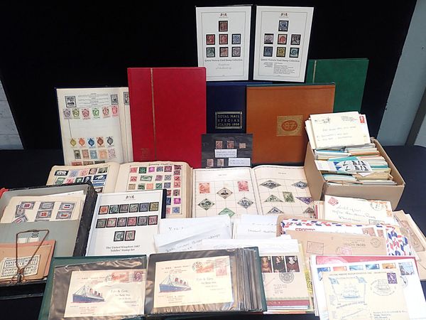 A LARGE COLLECTION OF STAMPS