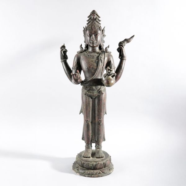 A MONUMENTAL JAVANESE BRONZE FIGURE OF SHIVA