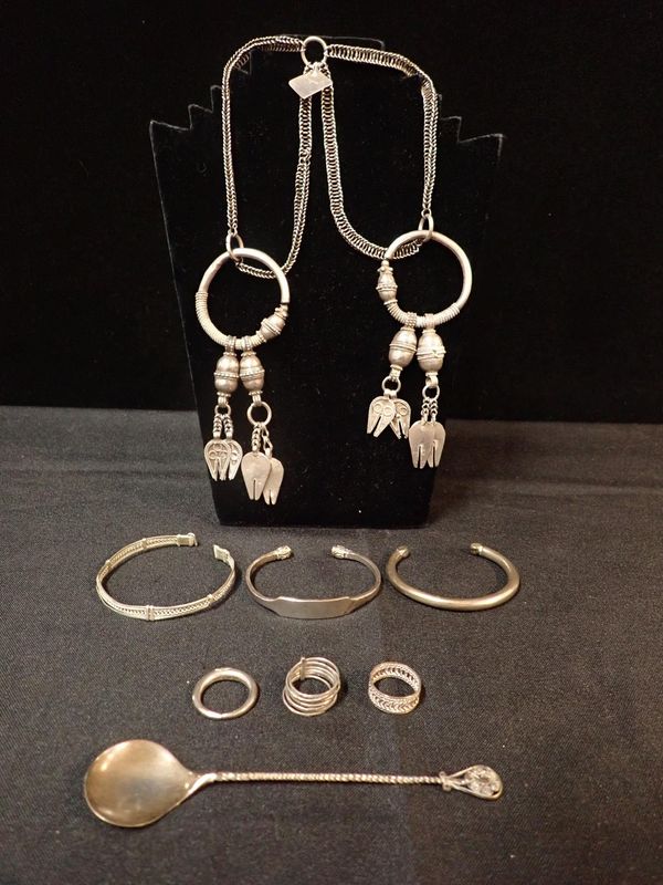 A COLLECTION OF AFRICAN WHITE METAL JEWELLERY