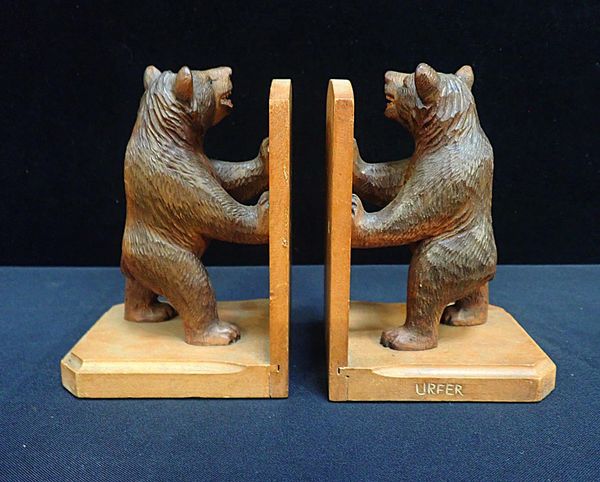 A PAIR OF BLACK FOREST STYLE BOOKENDS