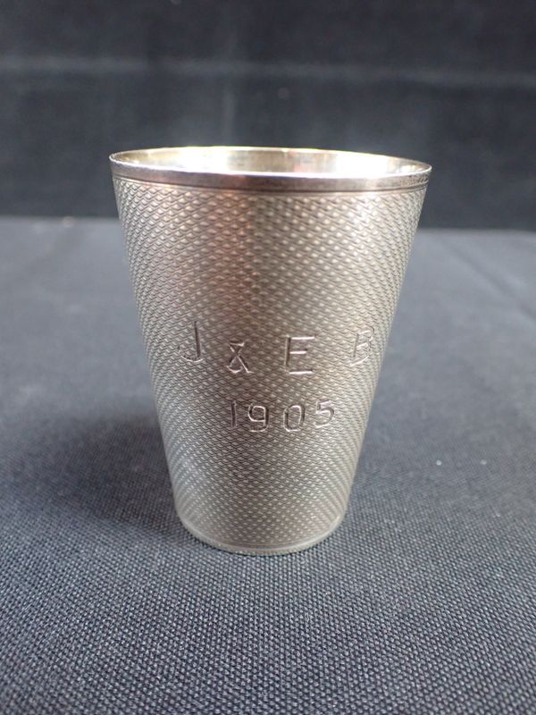 A SILVER ENGINE TURNED CUP