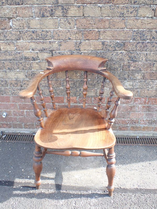 A 19TH CENTURY SMOKERS BOW ARMCHAIR