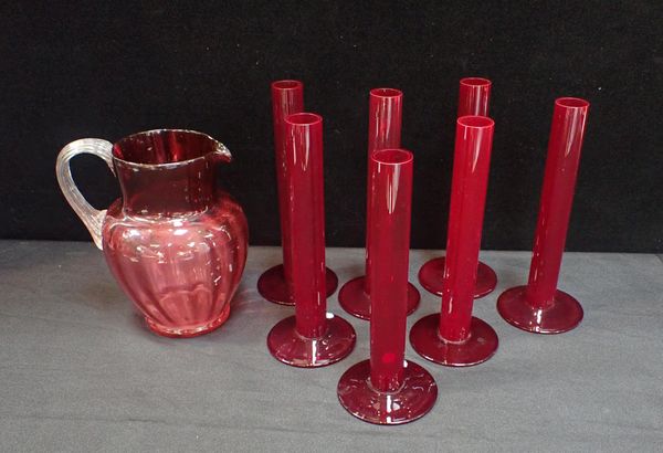 A GROUP OF RED GLASS SEULE FLEUR VASES