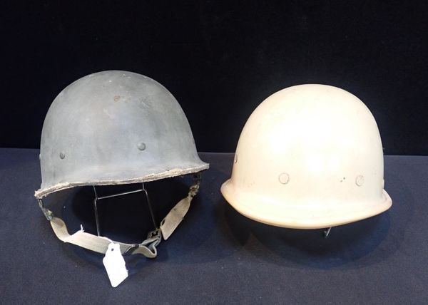 TWO IRAQI HELMETS