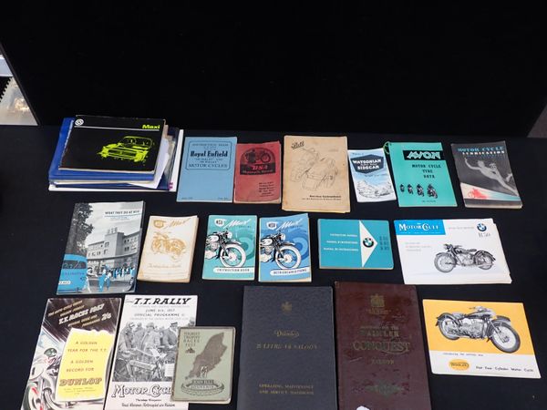 A COLLECTION OF CAR HANDBOOKS AND PROMOTIONAL MATERIAL