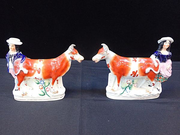 A PAIR OF STAFFORDSHIRE FLAT BACK COWS