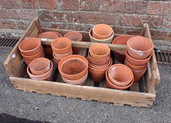 A WOODEN CRATE CONTAINING OLD TERRACOTTA FLOWERPOTS