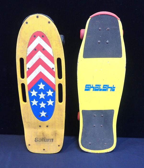 A VINTAGE SATURN STUNT SKATEBOARD